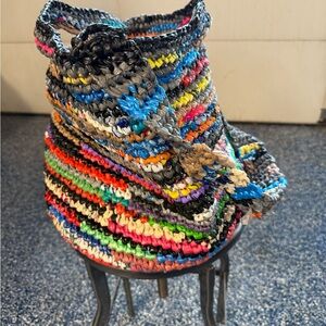 Handmade from plastic bags crocheted shopping tote bag with a pocket